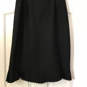 Black skirt with pleat detail at bottom